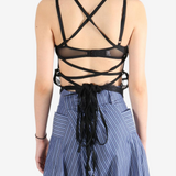 Black top worn by a person, showing the top's fit