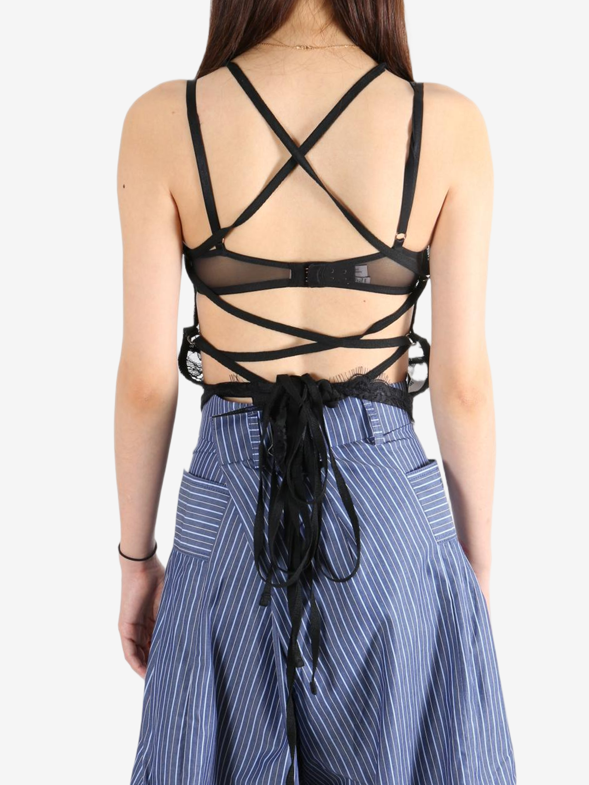 Black top worn by a person, showing the top's fit