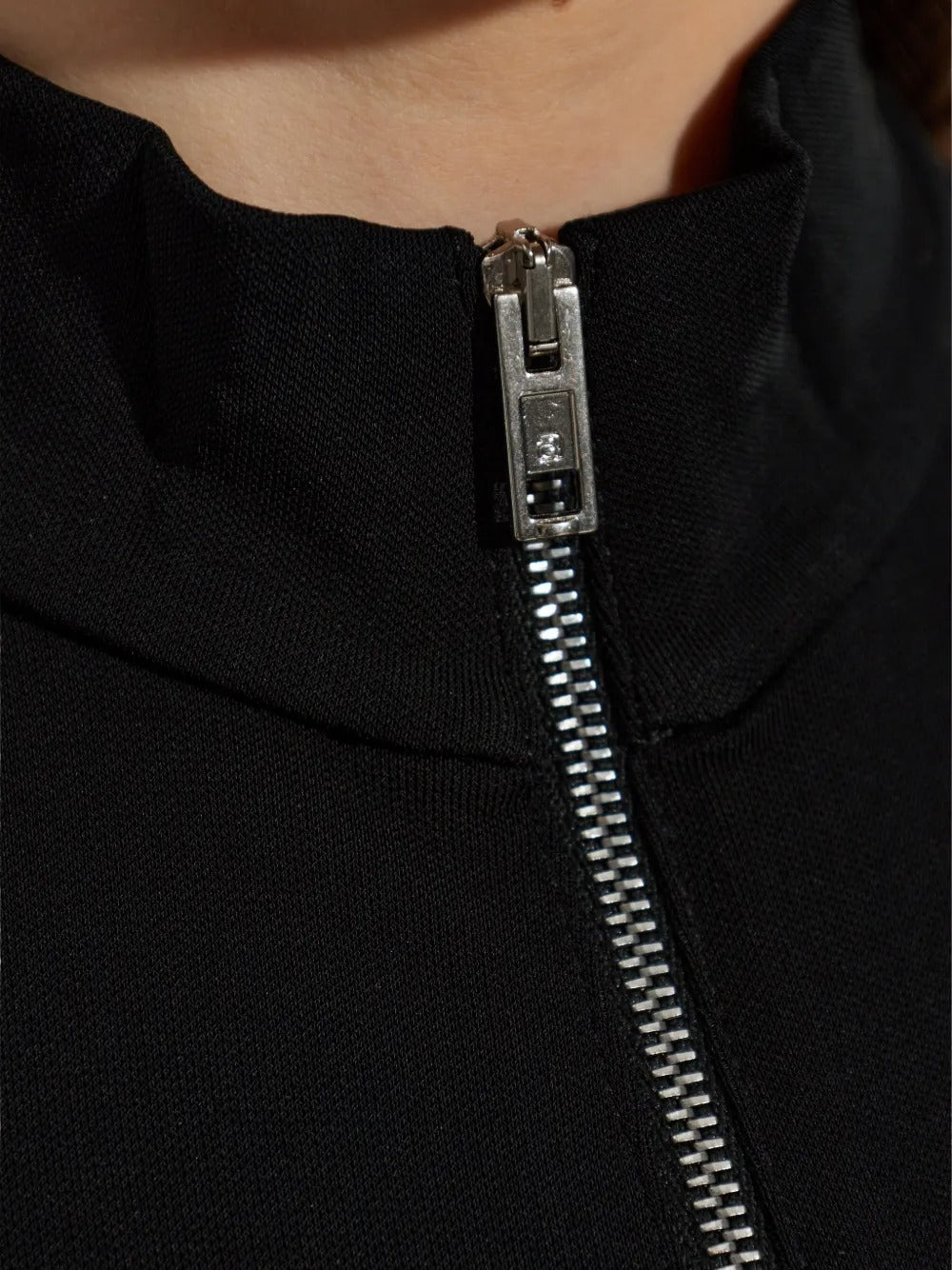 Close up black top, showing texture of the viscose fabric