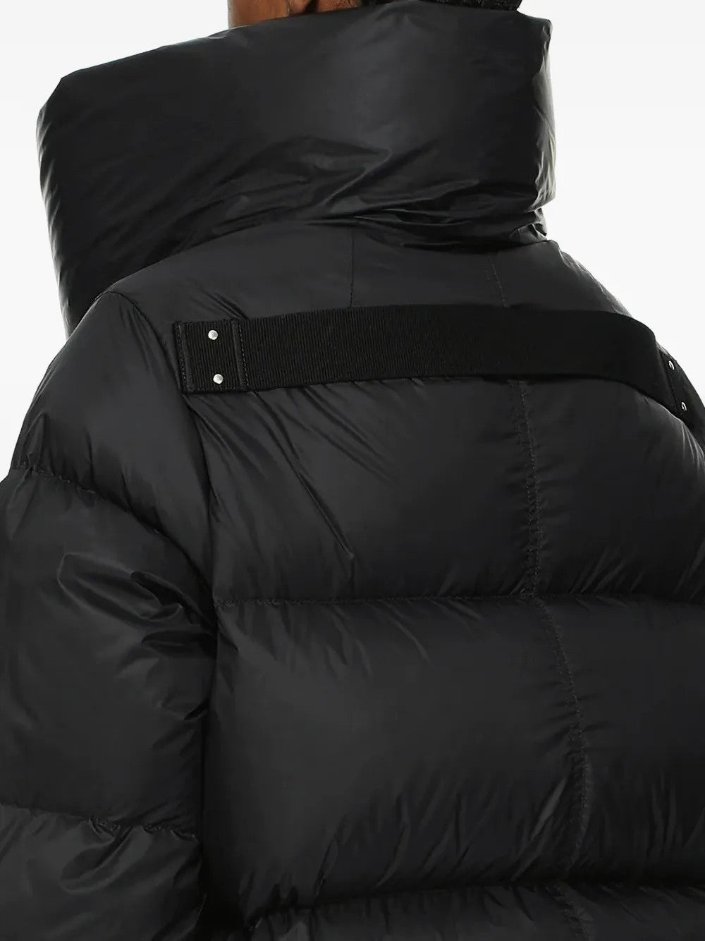 Black jacket worn by a person, showing the jacket fit