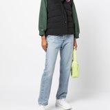 Black vest worn by a person, showing the vest's fit