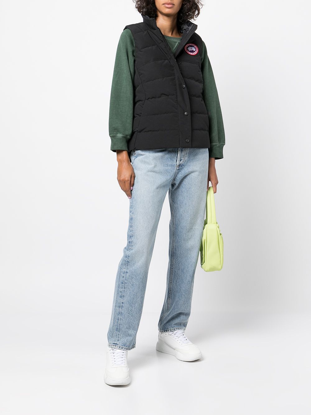 Black vest worn by a person, showing the vest's fit