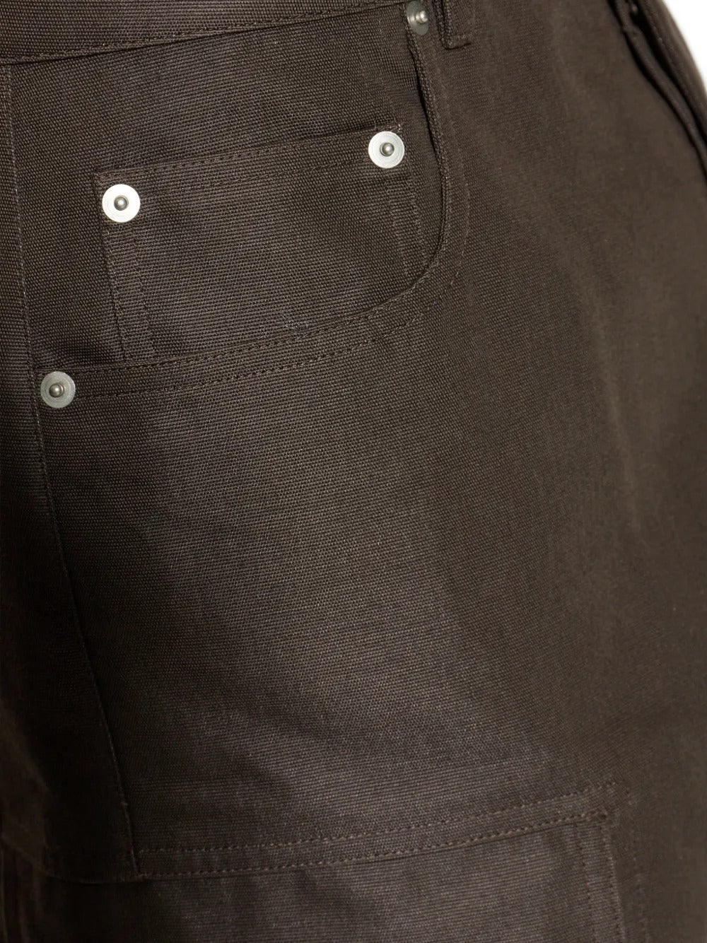 Close up of brown pants, showing texture of the polyamide and cotton fabric