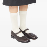 Brown shoes worn by a person, showing the shoes fit