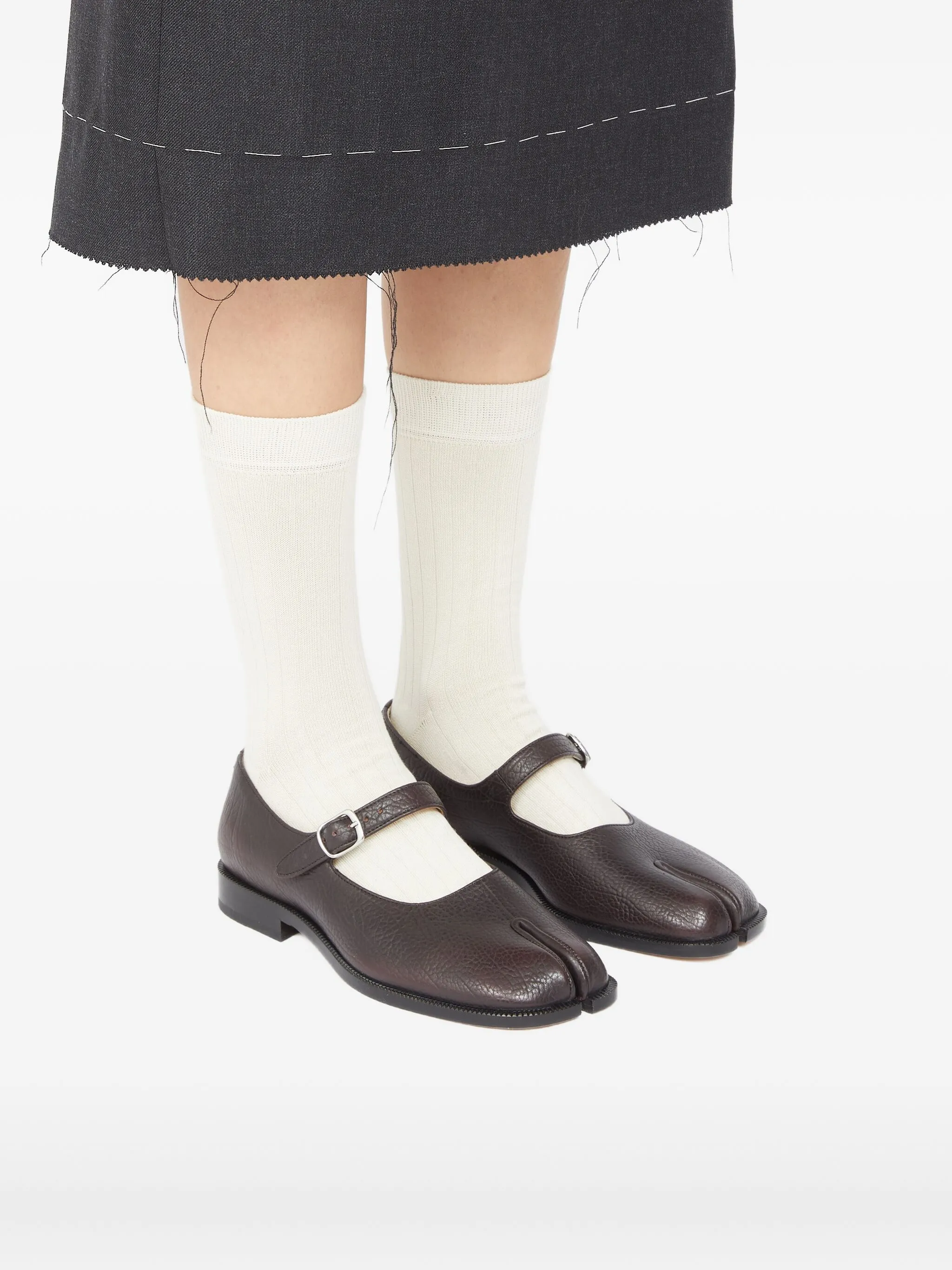 Brown shoes worn by a person, showing the shoes fit