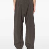 Brown pants worn by a person, showing the pants fit