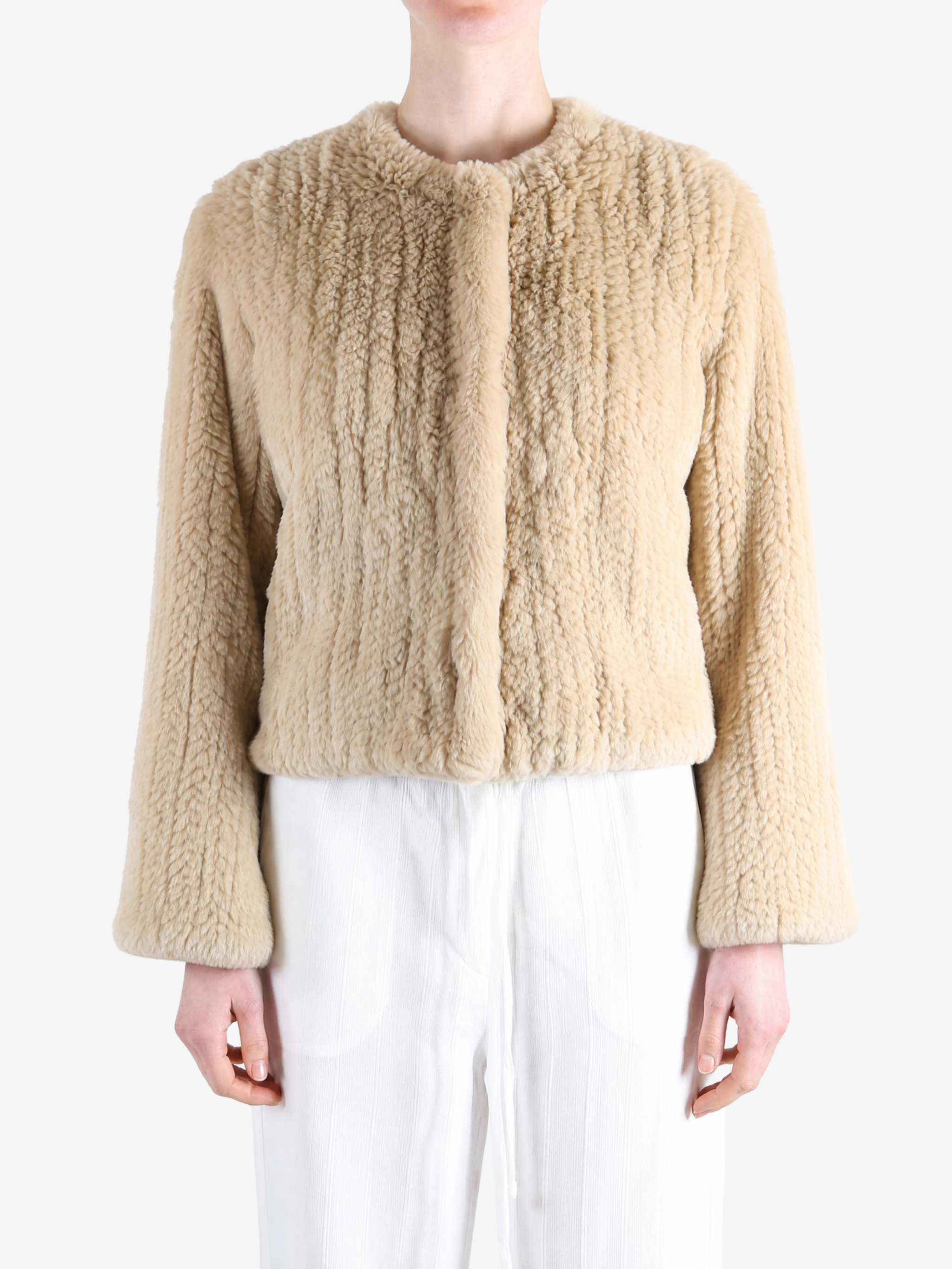 Tan jacket worn by a person, showing the jacket fit