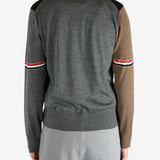 Blue knitwear worn by a person, showing the knitwear fit