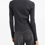 Grey tops worn by a person, showing the tops fit