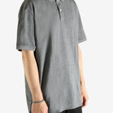 Grey T-shirt worn by a person, showing the T-shirt's fit