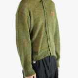 Green cardigan worn by a person, showing the cardigan's fit
