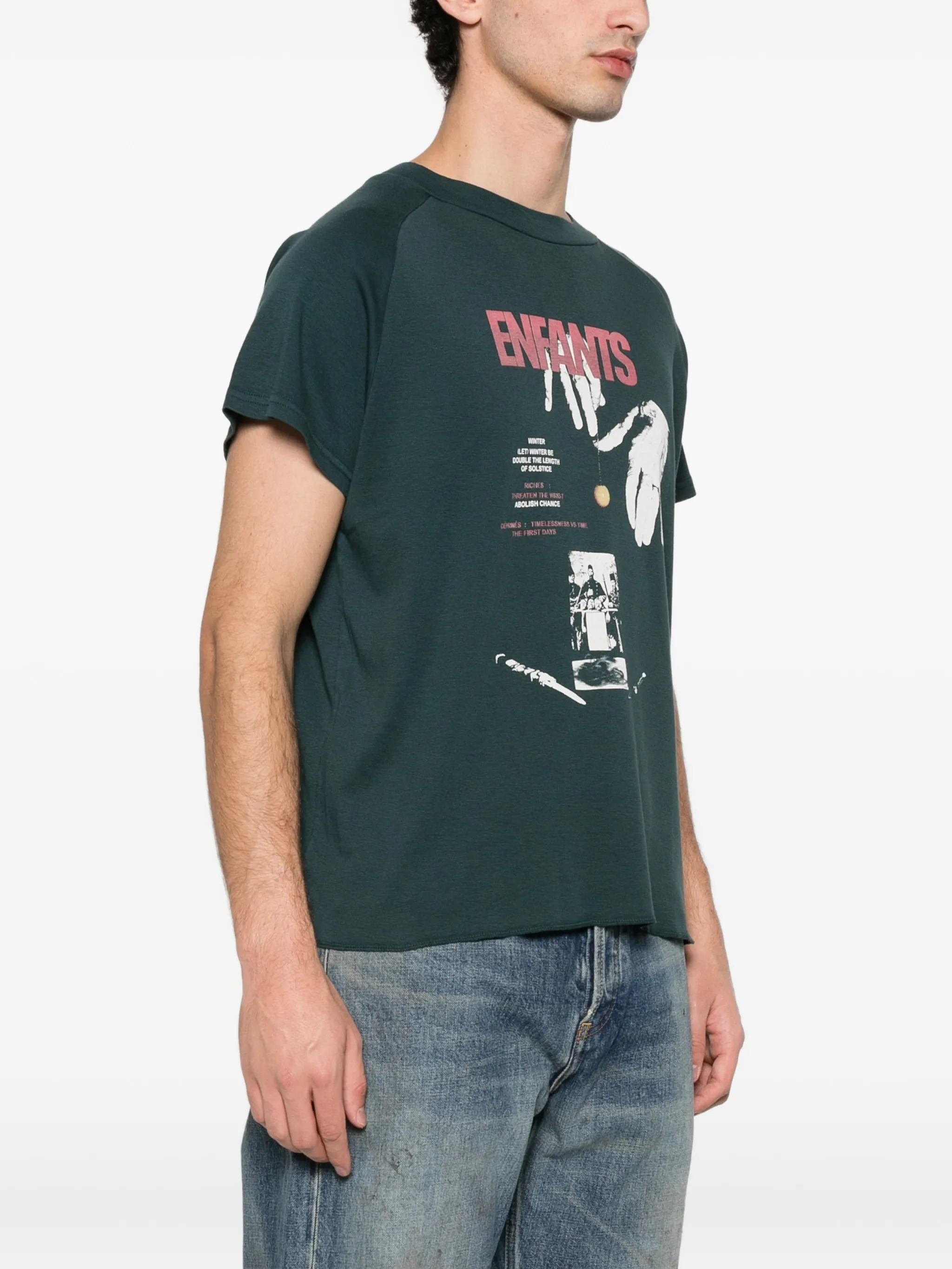 Green t-shirt worn by a person, showing the t-shirt's fit