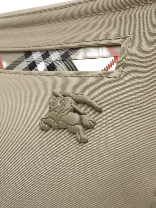 Close up of tan bag, showing texture of the polyester fabric