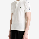 White shirt worn by a person, showing the shirt fit