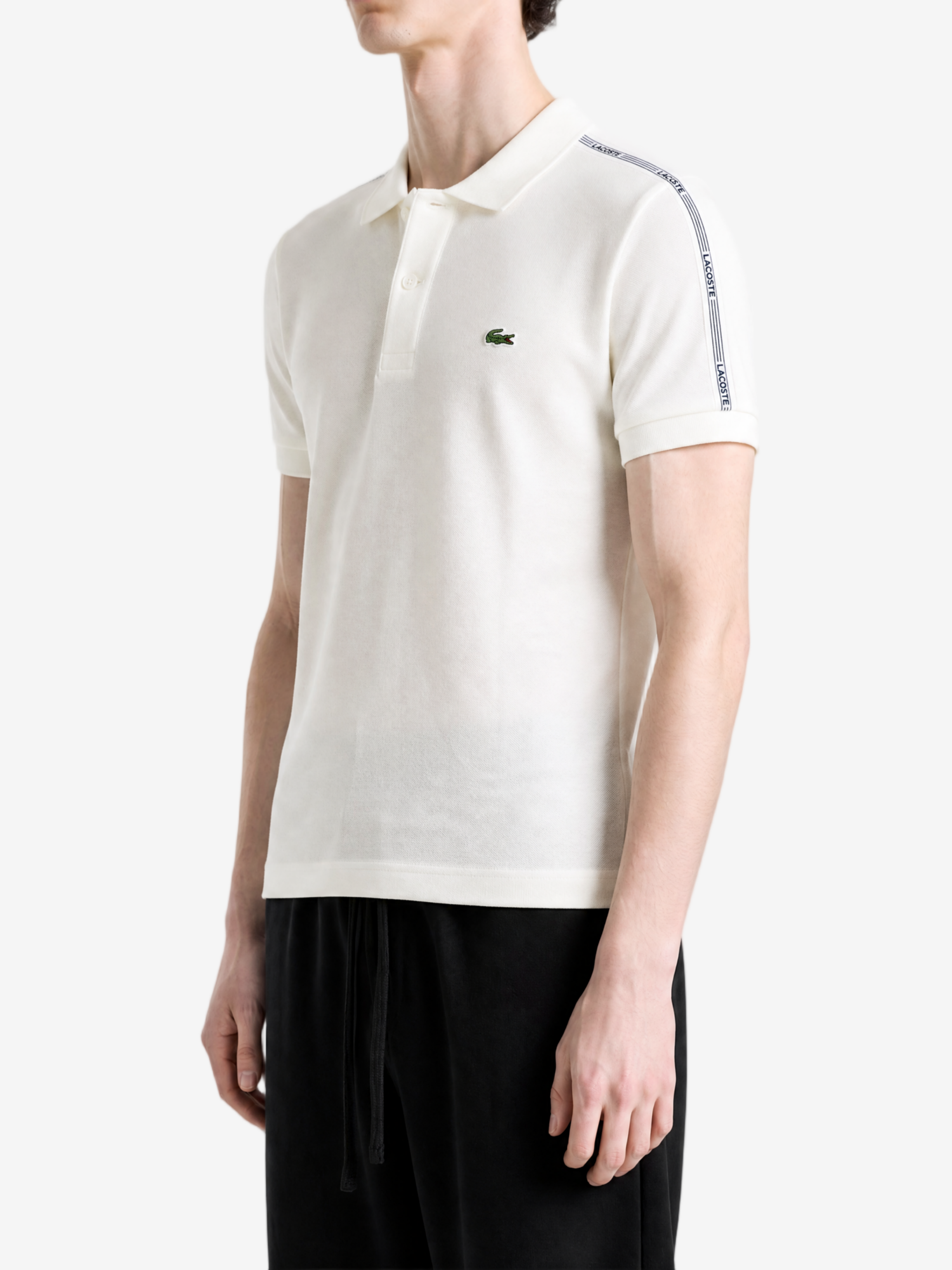 White shirt worn by a person, showing the shirt fit