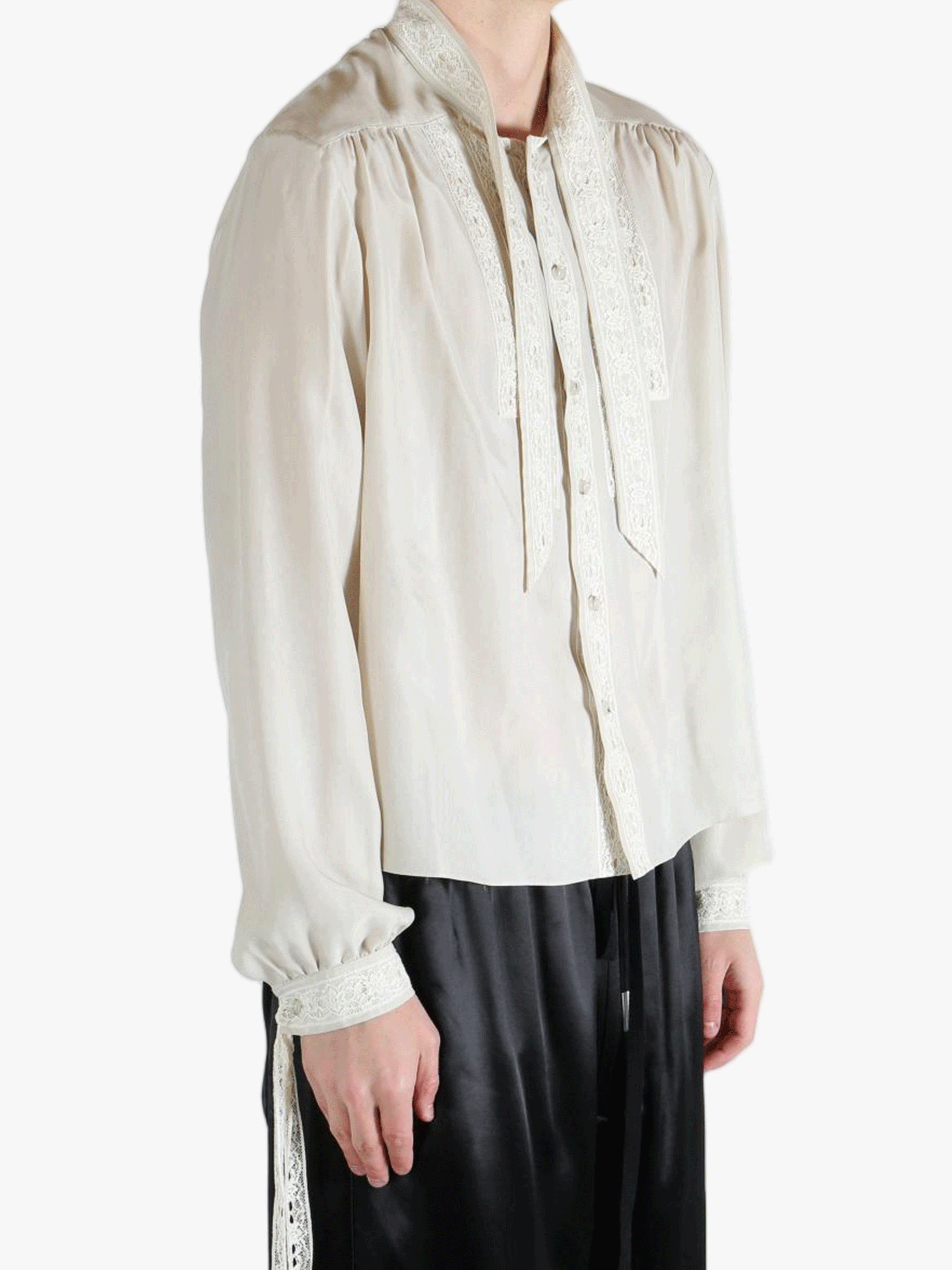White shirt worn by a person, showing the shirt's fit