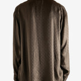 Brown shirt worn by a person, showing the shirt's fit