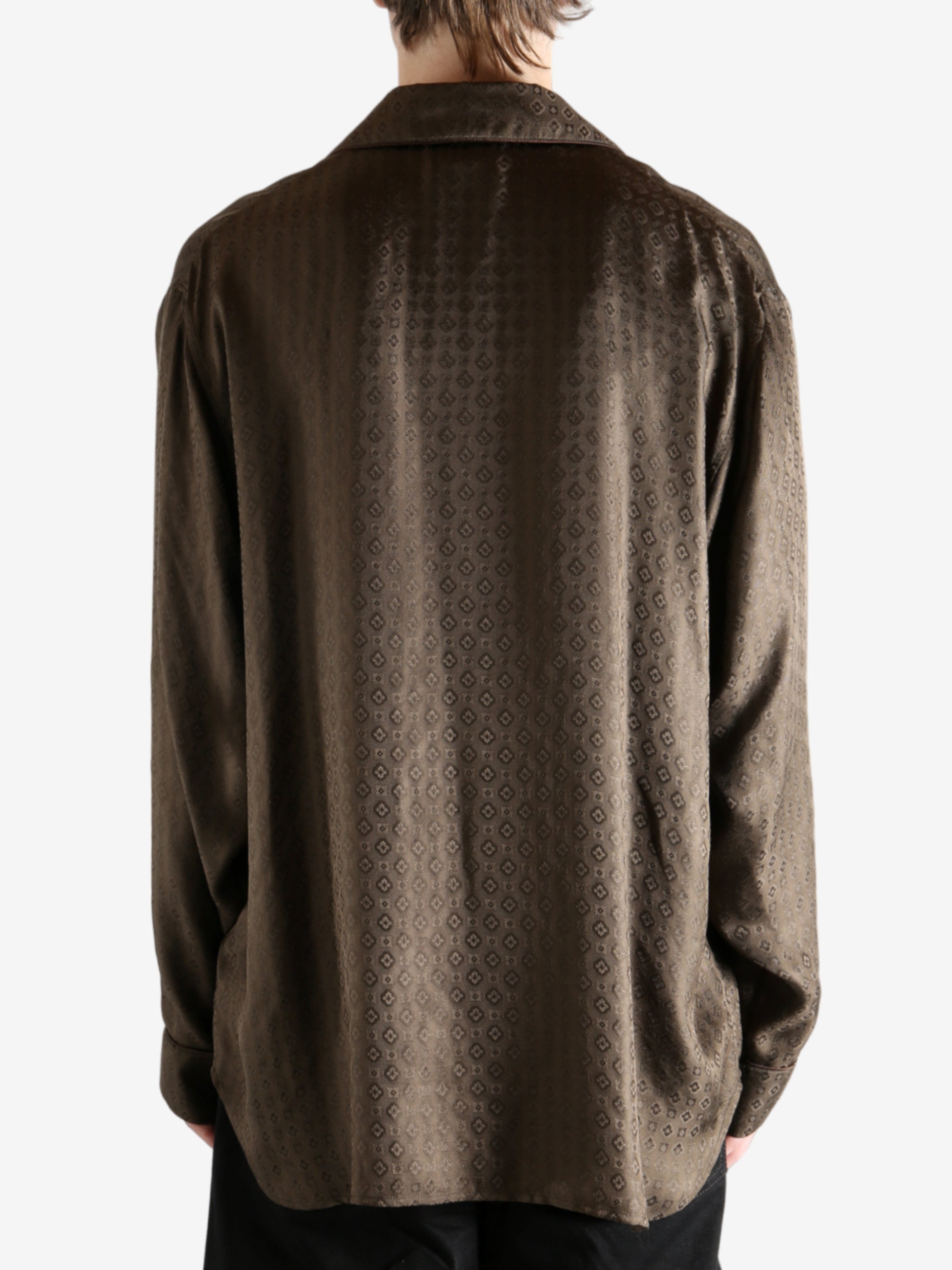 Brown shirt worn by a person, showing the shirt's fit