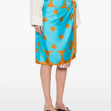 orange skirts worn by a person, showing the skirts  fit
