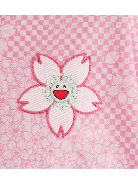 Close up of Pink t-shirt, showing texture of the 100% polyester fabric