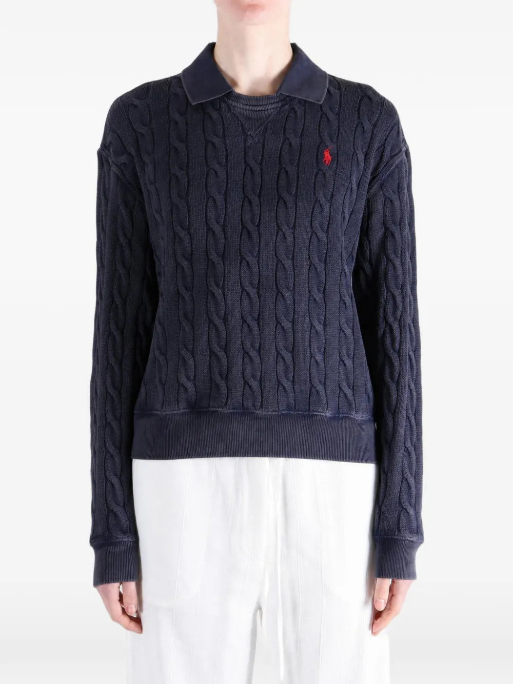 Navy shirt worn by a person, showing the shirt fit