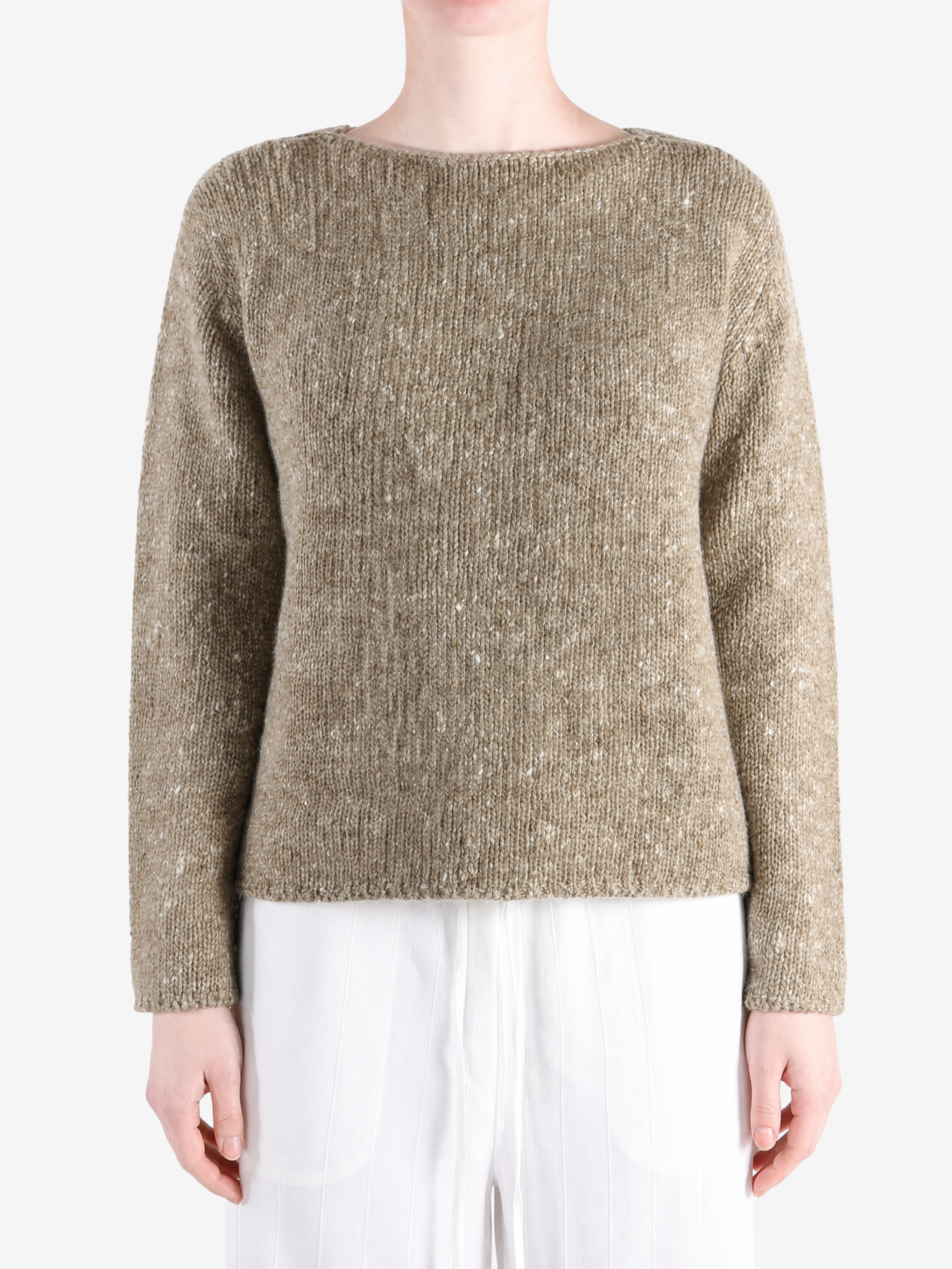 Tan knitwear worn by a person, showing the knitwear fit