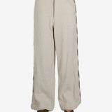 Tan pant worn by a person, showing the pant’s fit