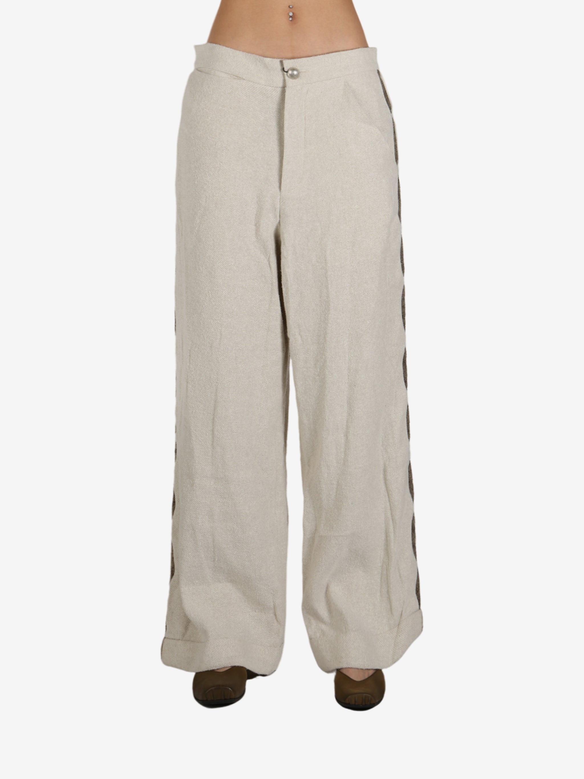 Tan pant worn by a person, showing the pant’s fit