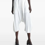 White shorts worn by a person, showing the shorts' fit