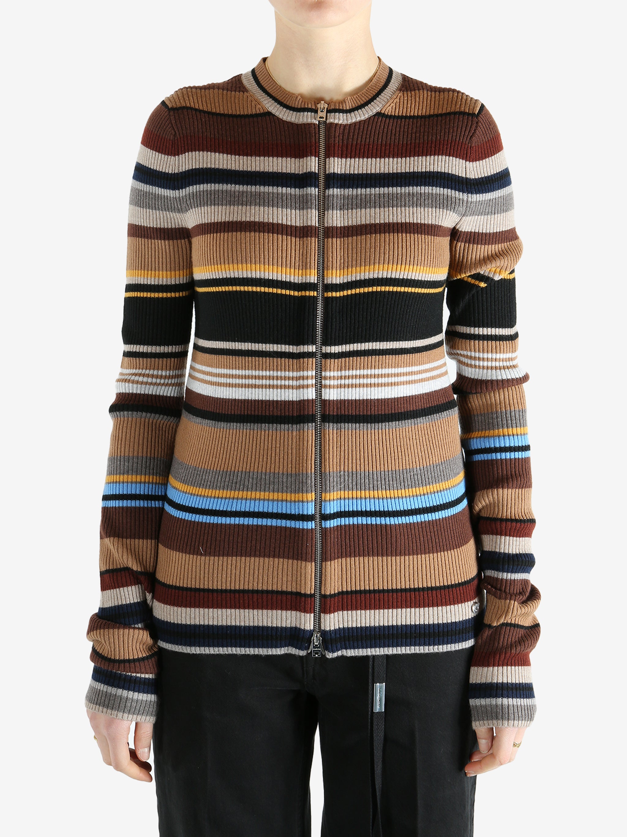 Brown sweater worn by a person, showing the sweater fit