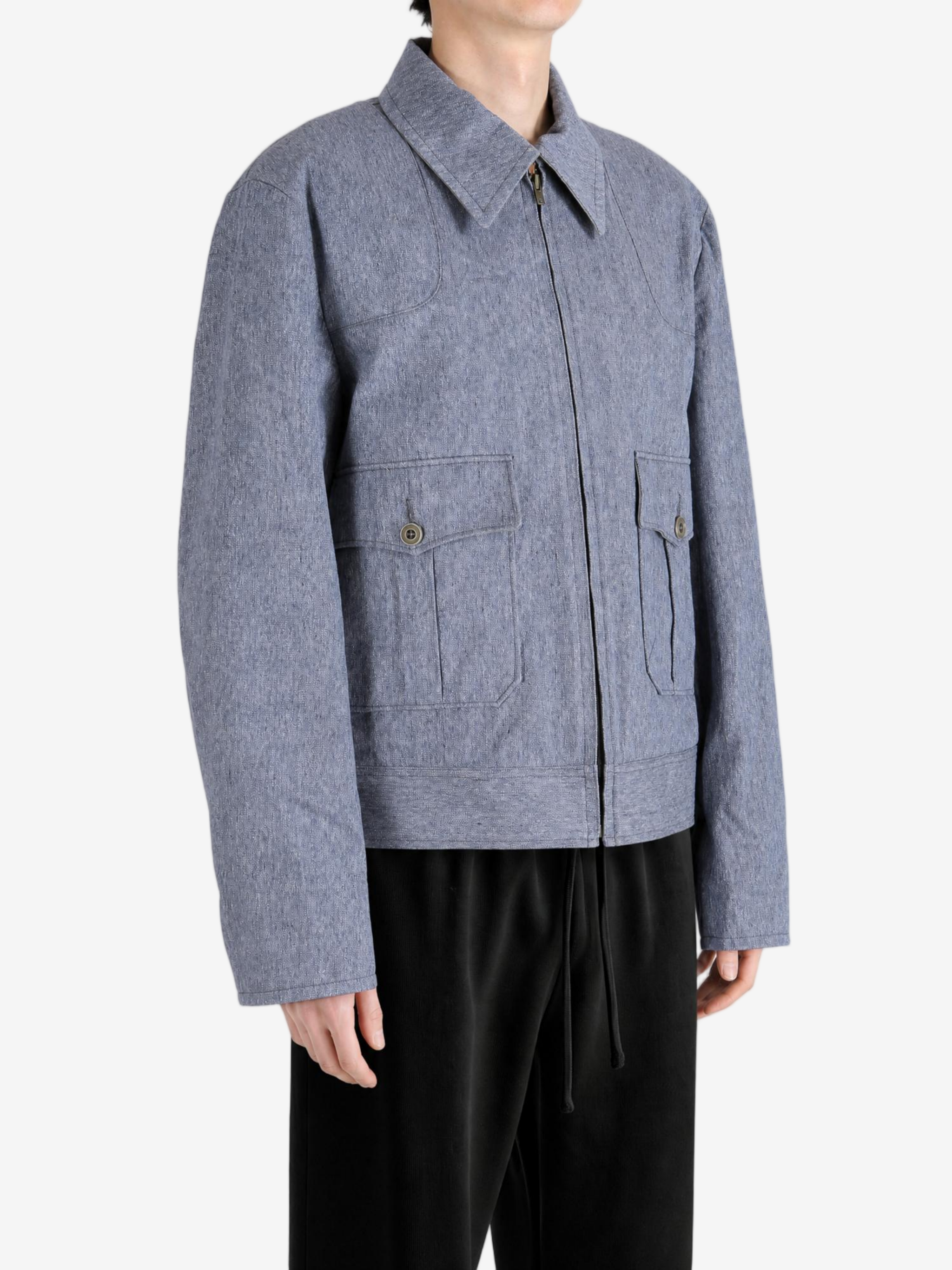 Blue jacket worn by a person, showing the jacket fit