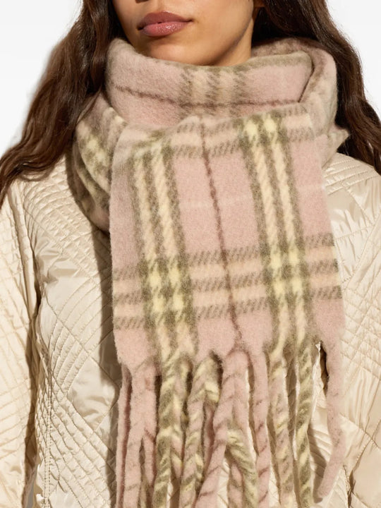 Pink scarf worn by a person, showing the scarf fit