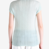 Blue shirt worn by a person, showing the shirt fit