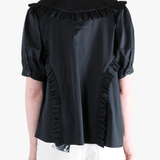 Black t-shirt worn by a person, showing the t-shirt's fit