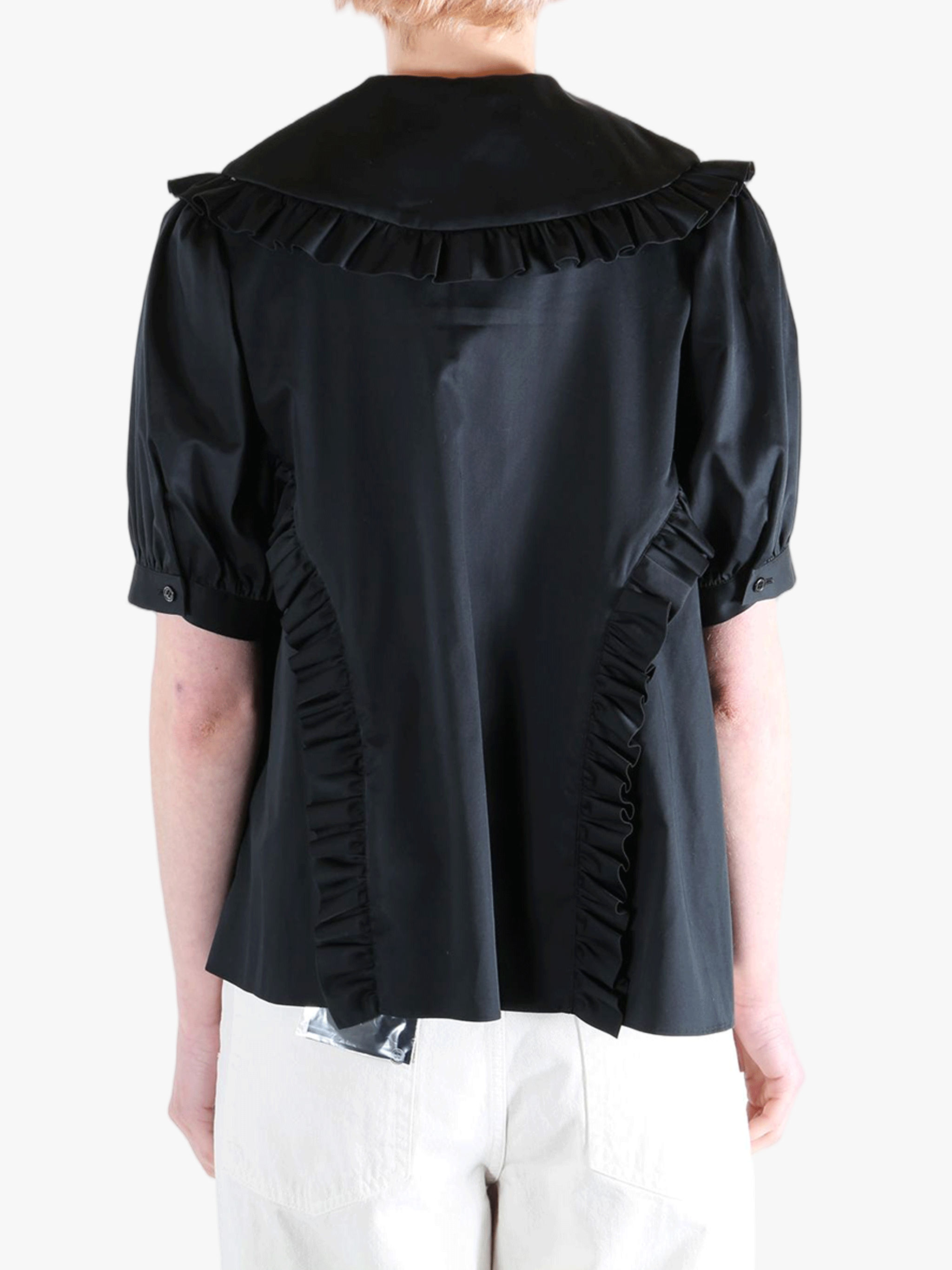 Black t-shirt worn by a person, showing the t-shirt's fit