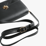 Close up of black bags, showing texture of the fabric