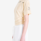 Tan top worn by a person, showing the top fit