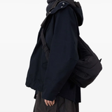 Black  bag worn by a person, showing the bag's fit