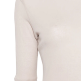Close up of beige t-shirt, showing the detail of material of cotton