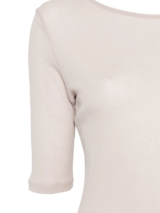 Close up of beige t-shirt, showing the detail of material of cotton