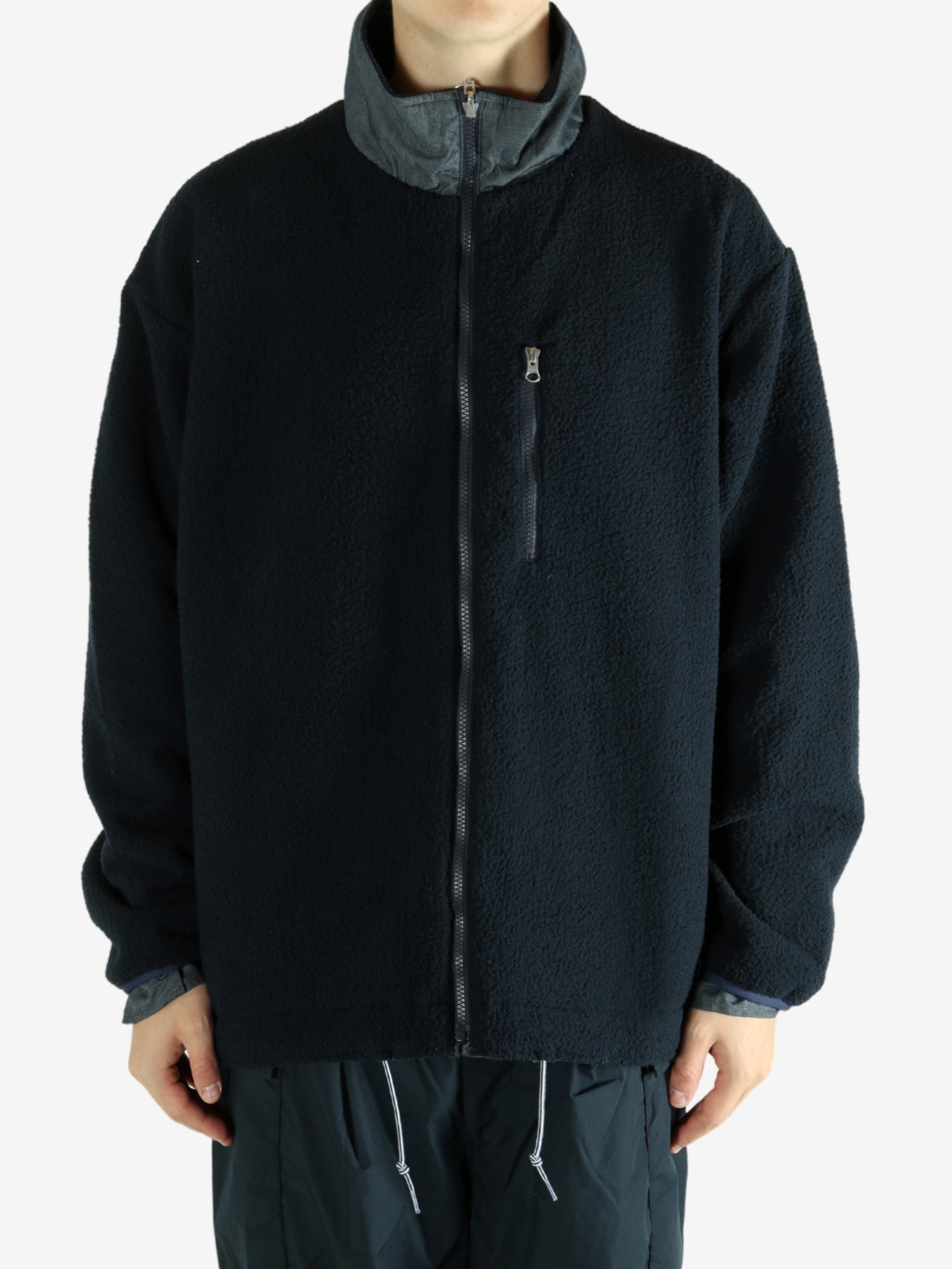 Navy jacket worn by a person, showing the jacket's fit