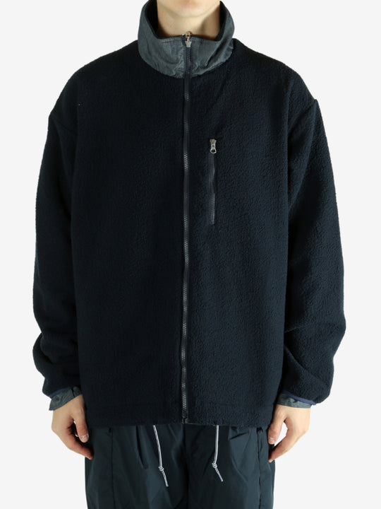 Navy jacket worn by a person, showing the jacket's fit