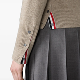 Close up of tan knitwear, showing texture of the Wool fabric