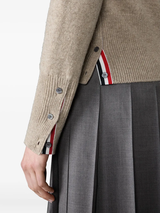 Close up of tan knitwear, showing texture of the Wool fabric