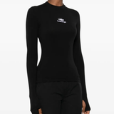 black tops worn by a person, showing the tops fit