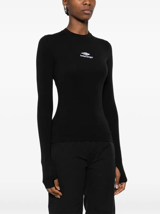 black tops worn by a person, showing the tops fit