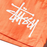 Close up orange shorts, showing texture of the cotton fabric