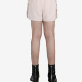 White short worn by a person, showing the short fit