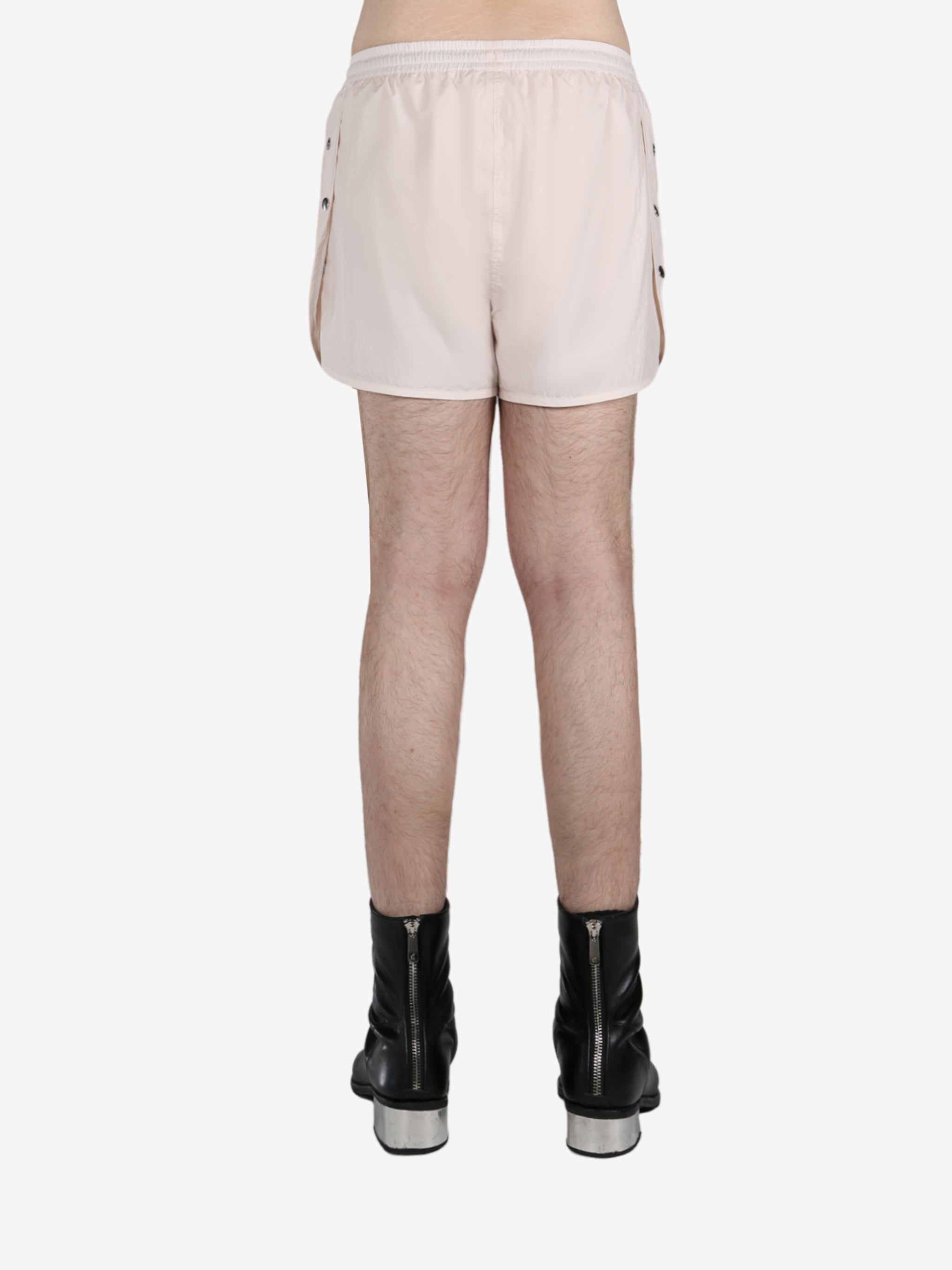 White short worn by a person, showing the short fit