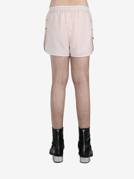 White short worn by a person, showing the short fit